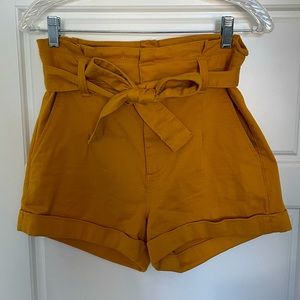 Mustard colored high waisted shorts
